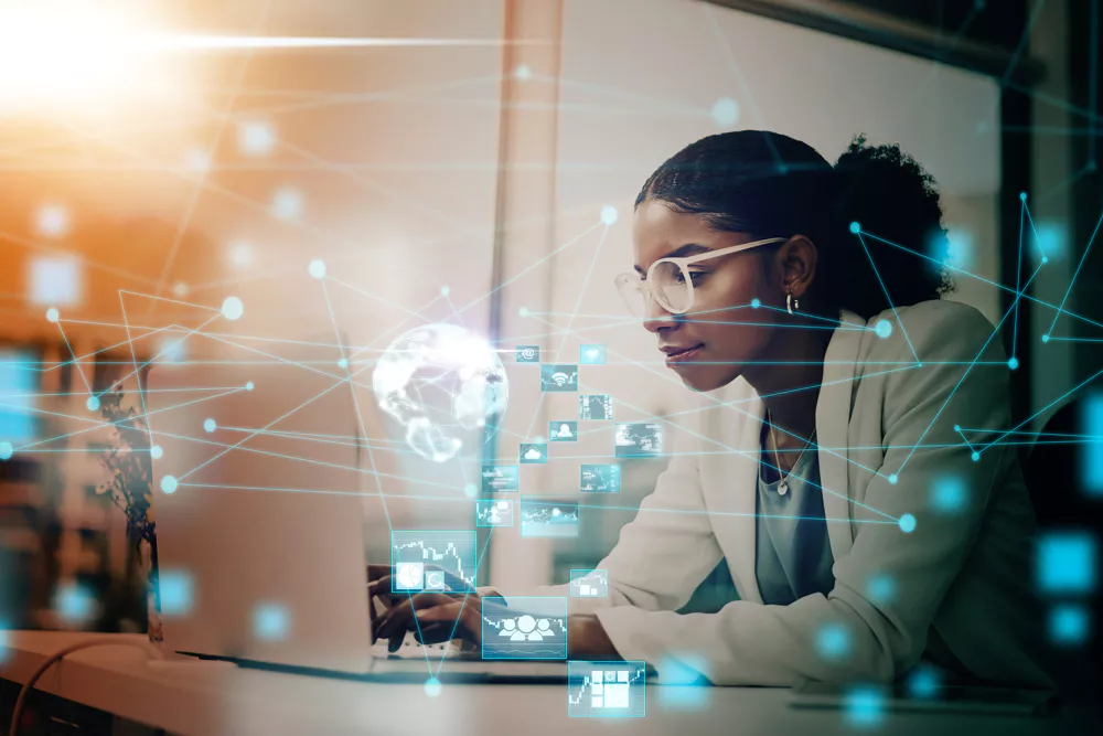 Professional using digital tools to analyze connected data and technology systems.